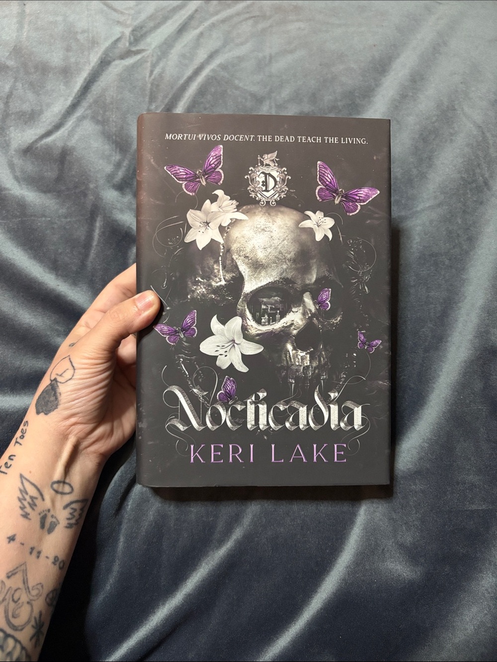 Nocticadia Hardcover Art Print - Black and Purple Skull Design